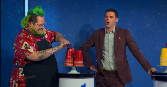 Is It Cake still where Andrew Fuller is cutting his cake in front of Mikey Day and the judges
